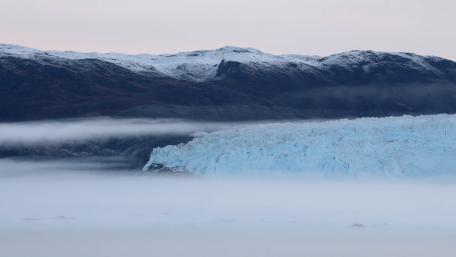 Majestic Glacier Among Misty Mountains wallpaper