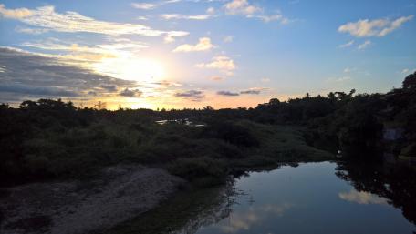 Serene Sunset Over Tranquil Waterway wallpaper