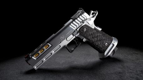 Sleek Pistol on Dark Background wallpaper