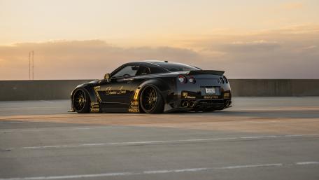 Sleek Sports Car at Sunset wallpaper