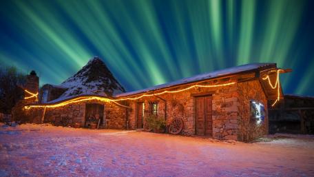 Enchanting Winter Night Under the Aurora Lights wallpaper