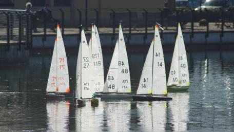 Sailing Regatta Reflections on Tranquil Waters wallpaper