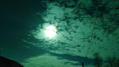 Mystical Moonlight Over Cloudy Skies wallpaper