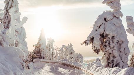 Snow covered mounatin road wallpaper