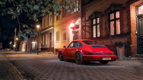 Vintage Elegance on a City Street at Night wallpaper
