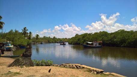 Tranquil River Scene with Boats wallpaper