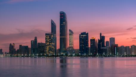 Vibrant Purple City Skyline at Dusk wallpaper