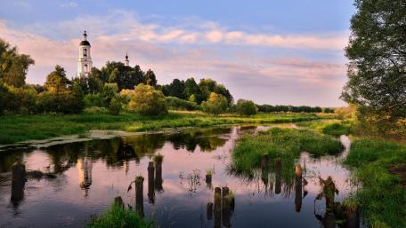 Tranquil Reflections of a Serene Church Landscape wallpaper