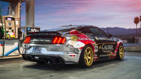 Muscle Car Gleaming at Sunset Gas Station wallpaper