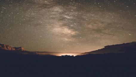 Celestial Beauty Over Majestic Mountains wallpaper
