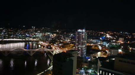 Nighttime Cityscape with Illuminated Bridge wallpaper