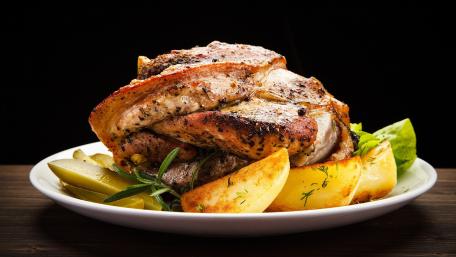 Savory Roasted Pork Loin Delightful Plate of Juicy Meat and Fresh Sides wallpaper