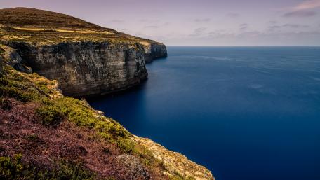 Majestic Cliff by the Sea in Tranquil Shores wallpaper