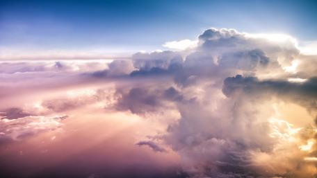 Majestic Cloudscape in Sunset Glow wallpaper