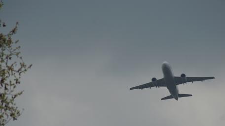 Majestic Airplane in Flight Above the Clouds wallpaper