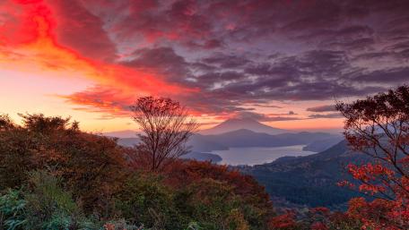 Majestic Autumn Sunset Over Serene Landscape wallpaper