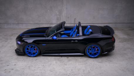 Sleek Black Cabriolet with Striking Blue Accents wallpaper