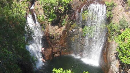 Majestic Waterfall Cascading Into Serene Pool wallpaper