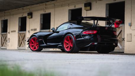 Sleek Black Dodge Viper with Bold Red Accents wallpaper