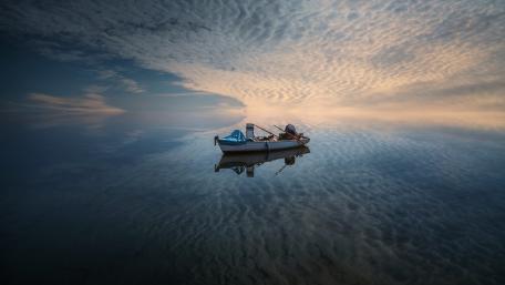Reflected fishing boat wallpaper