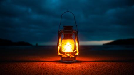 Rustic Lantern Illuminates Stormy Night wallpaper