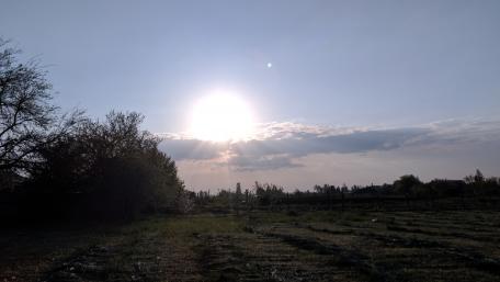 Serene Sunset Over Tranquil Fields wallpaper