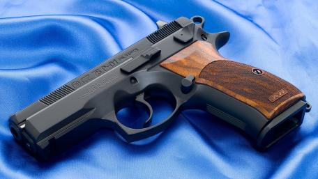 Military Precision Handgun on Display wallpaper
