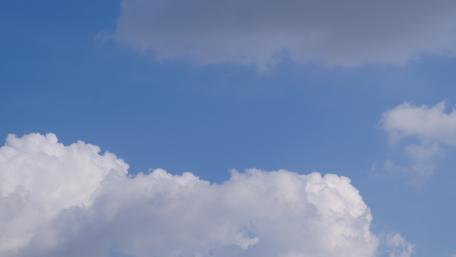 Serene Cumulus Clouds Under Bright Blue Sky wallpaper