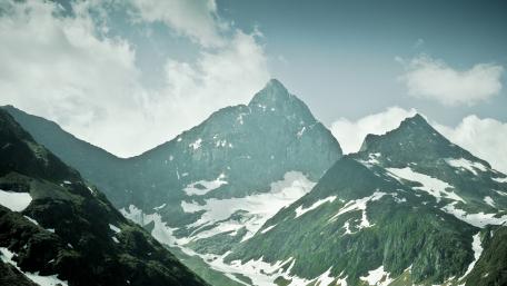 Majestic Mountain Peaks in Serene Landscape wallpaper