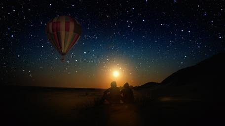 Hot air balloon on the starry night sky wallpaper