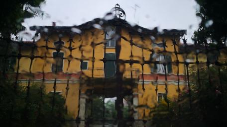 Charming House Behind a Rainy Fence wallpaper