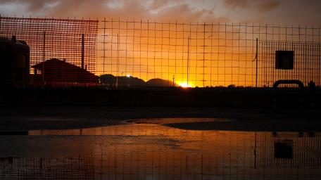Sunset Reflection Over Urban Landscape wallpaper