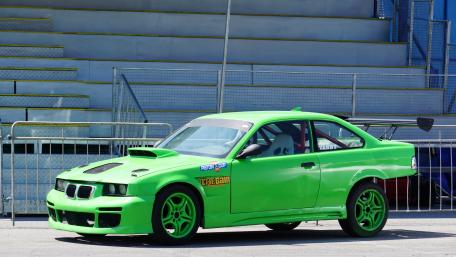 Vibrant Green Race Car Wallpaper wallpaper