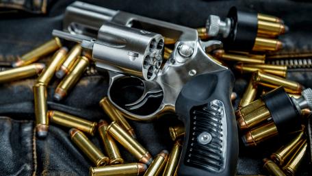 Steel Revolver & Bullets Display wallpaper