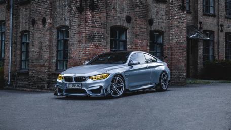Sleek Silver BMW Coupe in Urban Setting wallpaper