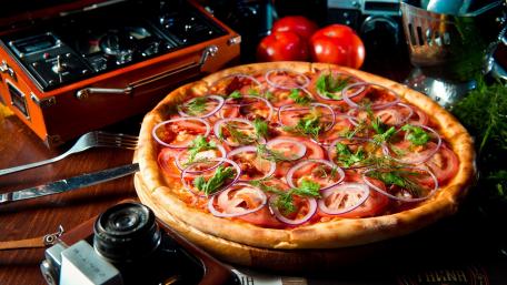 Pizza Delight in a Rustic Setting wallpaper
