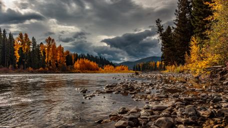 Autumn River Serenity Amidst Mountains wallpaper