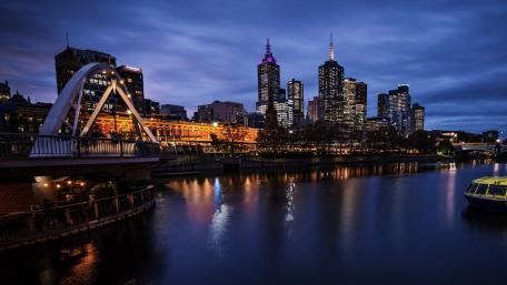 Stunning Night Cityscape Over Tranquil River Views wallpaper