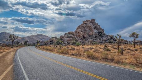 Scenic Highway Through Majestic Badlands wallpaper