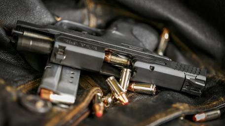Locked and Loaded: Handgun and Ammo Display wallpaper