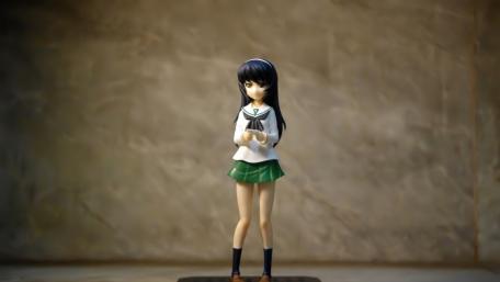 Lonely Anime Schoolgirl Figurine in Soft Light wallpaper