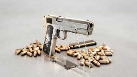 Stylish Colt Pistol with Ammunition Displayed wallpaper