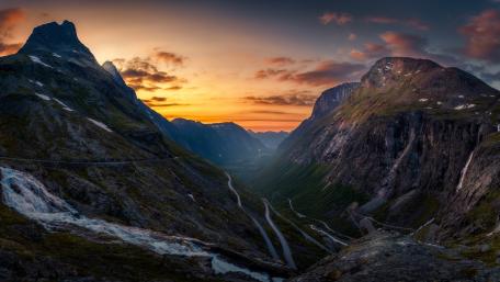 Curvy road in the mountains at sunset wallpaper