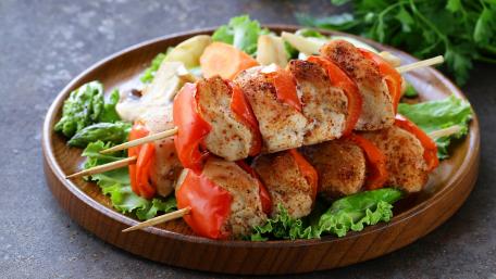 Delicious Grilled Kebab Platter with Fresh Vegetables wallpaper
