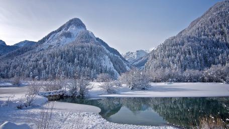 Half-frozen mountain lake wallpaper