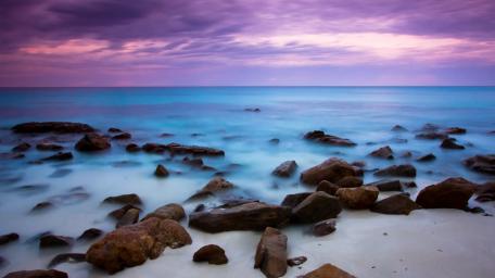 Blue sea and purple sky wallpaper