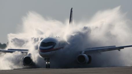 Boeing Jet Powering Through Intense Takeoff Spray wallpaper