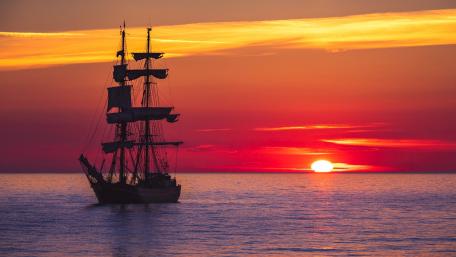Masted ship in the sunset wallpaper