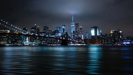 The Brooklyn Bridge and the Empire State Building at night wallpaper