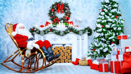 Cozy Christmas Scene with Santa Claus wallpaper